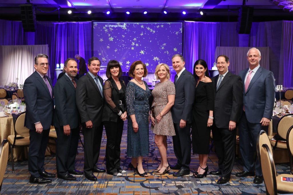 Carl Josehart, Phillip Tennenbaum, Bert & Jamie Wolf, Linda Burger, Sandi & Steven Wolf, Aileen & Mark Weycer, Marc Oster at Jewish Family Service annual celebration. (Photo by Johnny Than)
