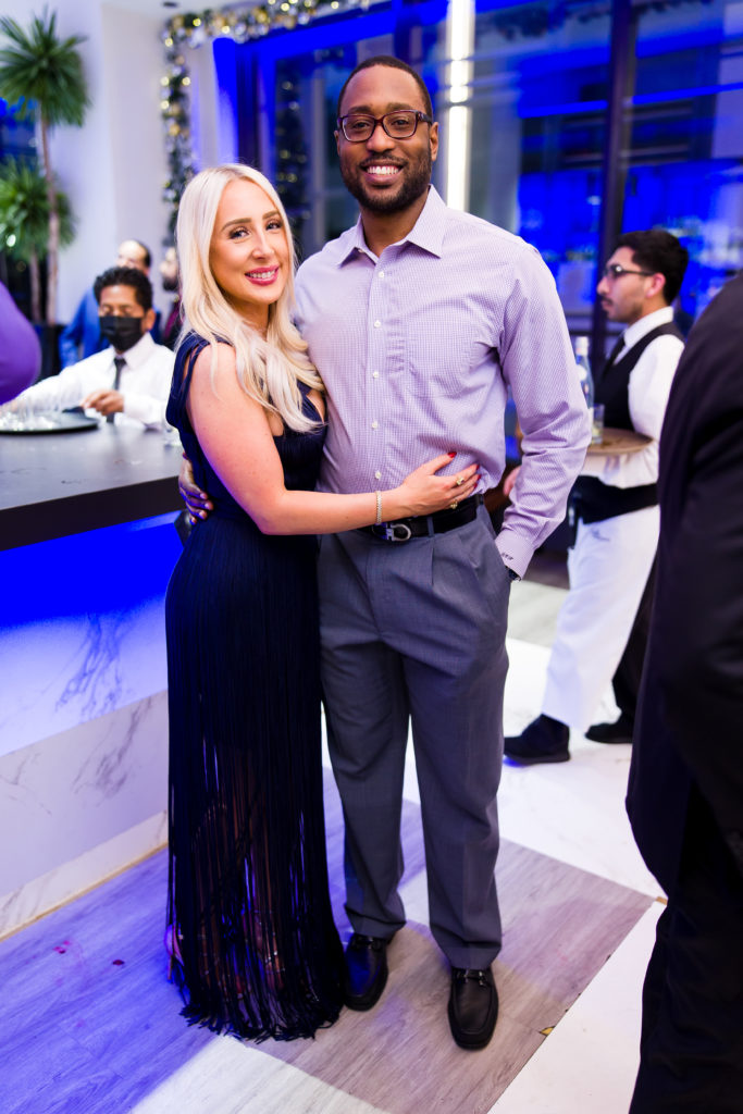 Britanny & Dr. Richard Harris at Construction Concepts' holiday party for a cause (Photo by Hung L. Truong Photography)
