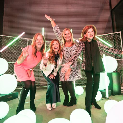 Duvall family and friends enjoying the "Turn Up the Lights" custom photo opp