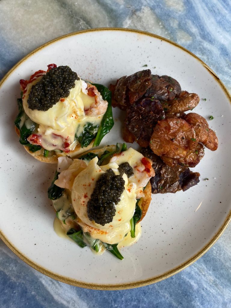 Decadent Eggs Benedict with lobster and caviar on the brunch menu at Gratify (Photo by Shelby Hodge)