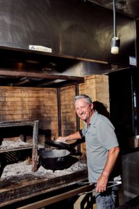 Chef Tim Love has things smoking on the hearth.