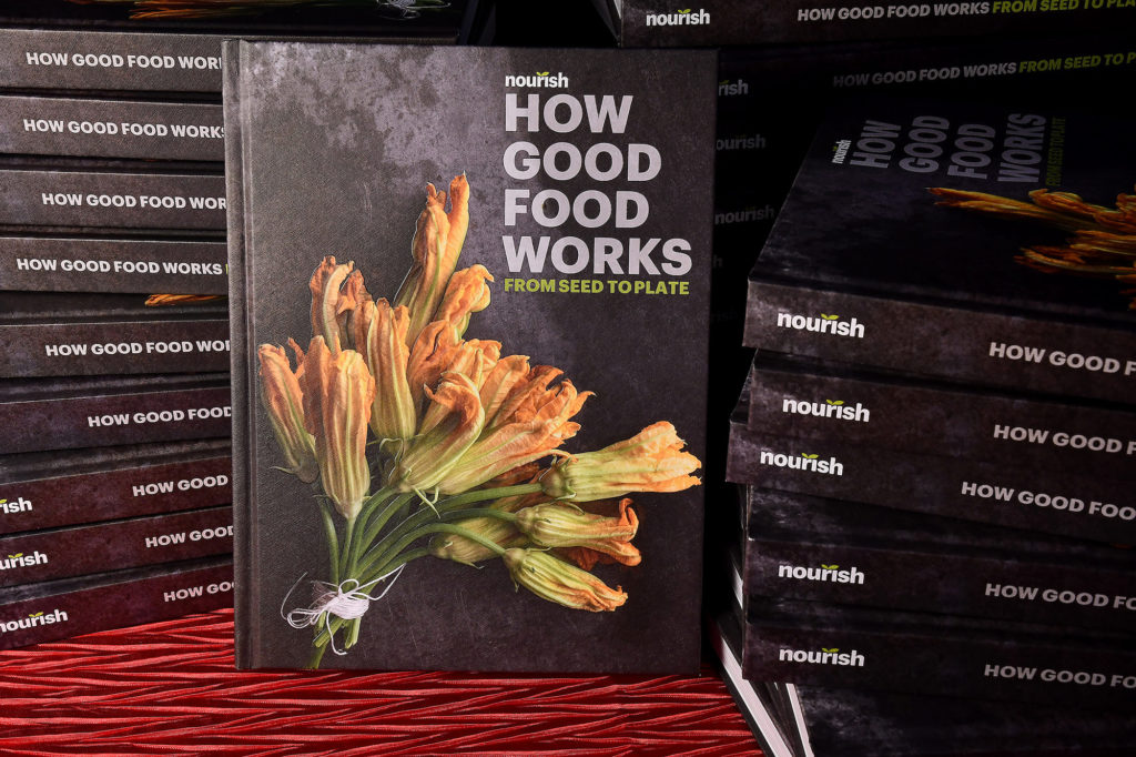 Books on display at the Nourish cookbook launch party. (Photo by Dave Rossman)