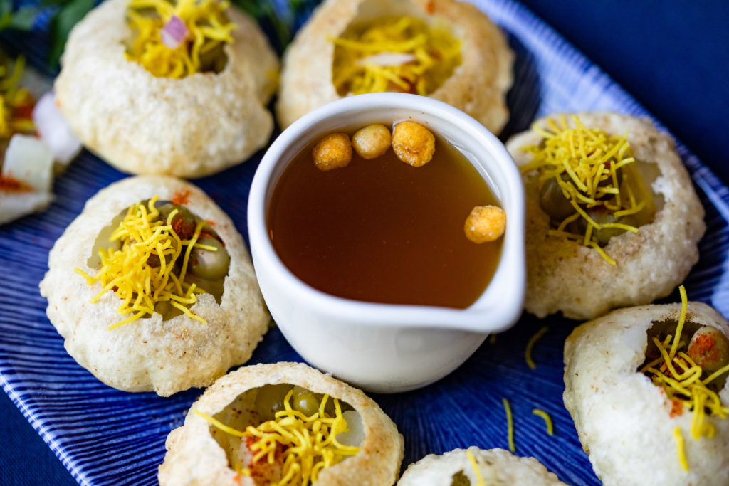 The pani puri appetizer should be filled to the brim with the accompanying sauce and gobbled up in one bite! Photo by Kirsten Gilliam.