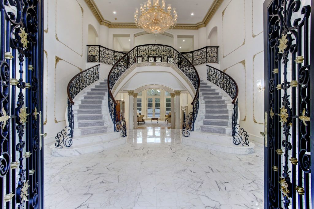 The grand two-story high entry hall at 6 Pine Tree Lane (Photo by TK Images)