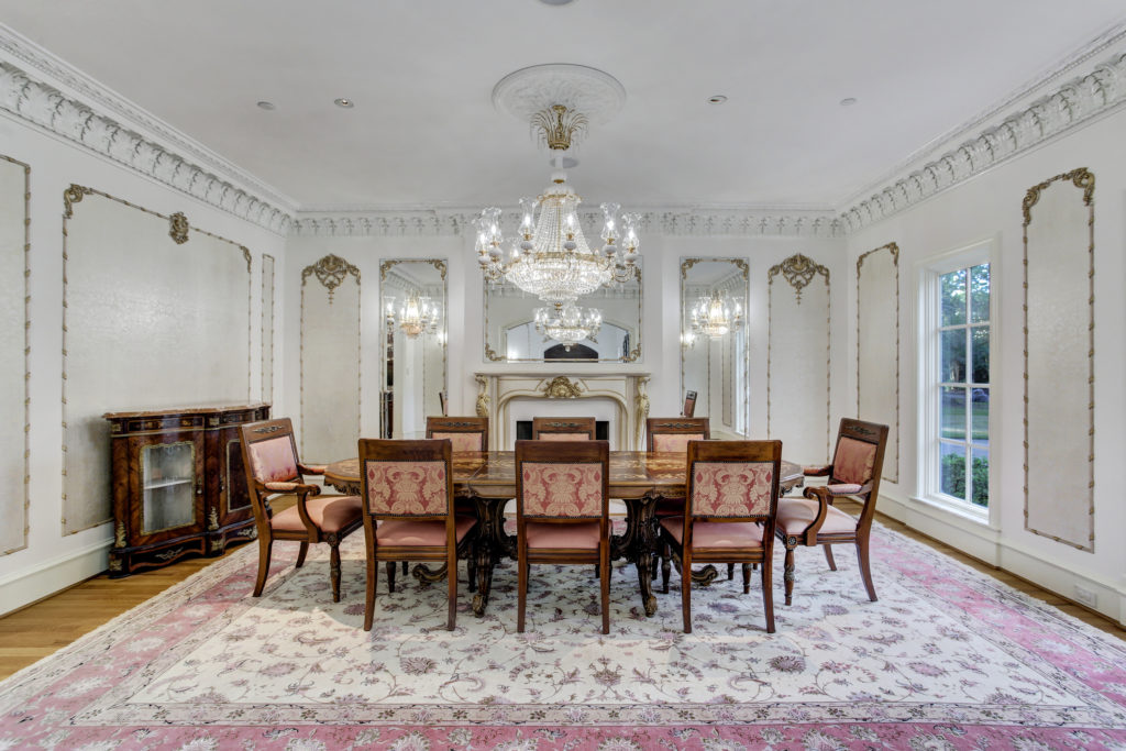 The formal dining room at 6 Pine Tree Lane features a gas burning fireplace. (Photo by TK Images)