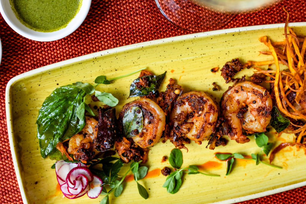 This fusion-style appetizer, shrimp malabar cajun blends local flavors with that of India. Photo by Kristen Gilliam.