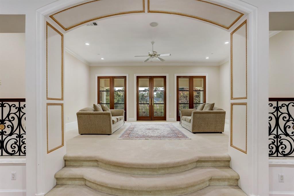 The second floor family room opens to the two story grand entry hall as well as the backyard terrace at 6 Pine Tree Lane. (Photo by TK Images)