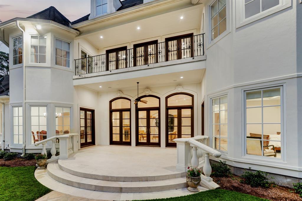 The second floor balcony overlooks the pool and vast backyard at 6 Pine Tree Lane. (Photo by TK Images)