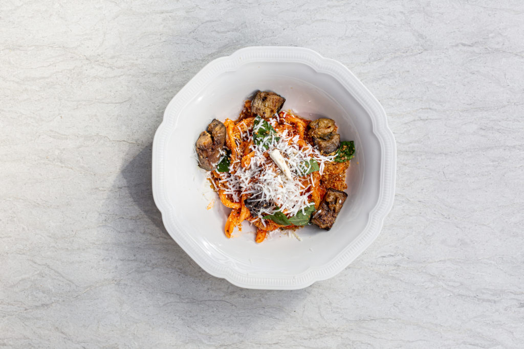 A famous dish from Sicily, Casarecce Alla Norma ($22), is a scroll-like pasta that holds the weight of fried eggplant chunks in a spicy tomato sauce tossed with shaved ricotta salata.(Photo Jenn Duncan)