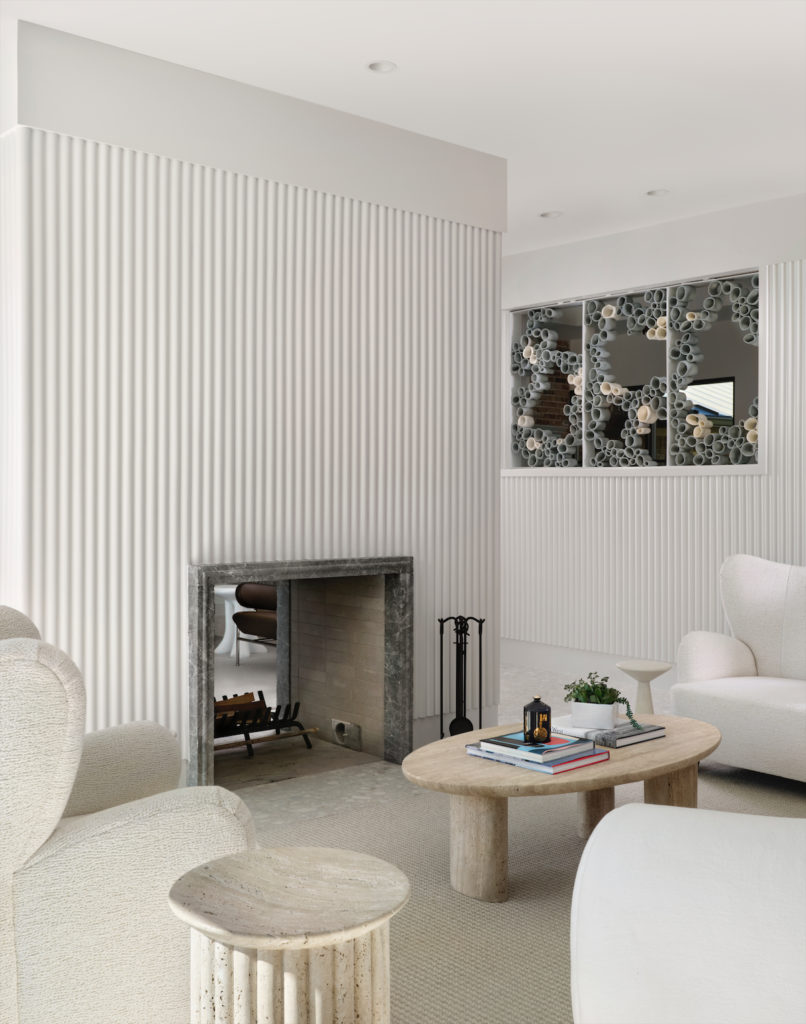 Floating plaster walls help define seating areas in the living area and offer privacy from the entry. Wall sculpture by Elizabeth Kendall through Marie Park Art & Consulting. Strike fireplace by Chad Dorsey Design. McGuire tables. Custom seating by EJ Victor.  (Photo by Lisa Petrole)