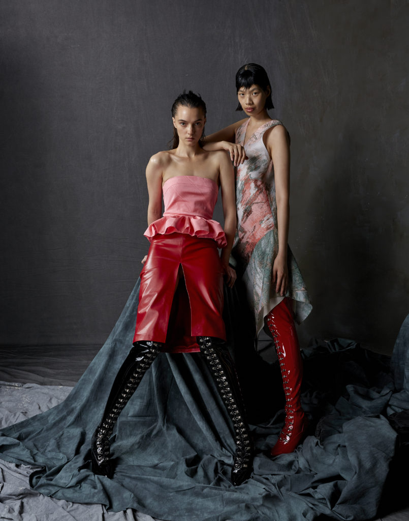 Bach Mai rococo pink moiré strapless peplum top and courtesan red Napa leather front-slit pencil skirt, multicolor abstract fil-coupe organza jacquard bias shift dress with V-neck and square hem. (Photo by Dimitri Hyacinthe)
