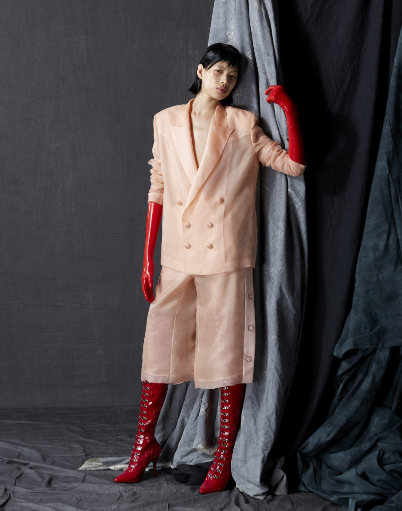 Bach Mai blush silk organza double breasted tailored jacket with silk satin organza revers and chiffon lining, tearaway pants with silk satin organza plackets, silk chiffon lining, and rose gold ring snaps. (Photo by Dimitri Hyacinthe)