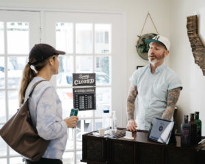 Sipple owner Danny Frounfelkner discusses the alcohol-free offerings at the shop he runs with his wife, Helenita, in Rice Village. (Photo by Therron Francis)