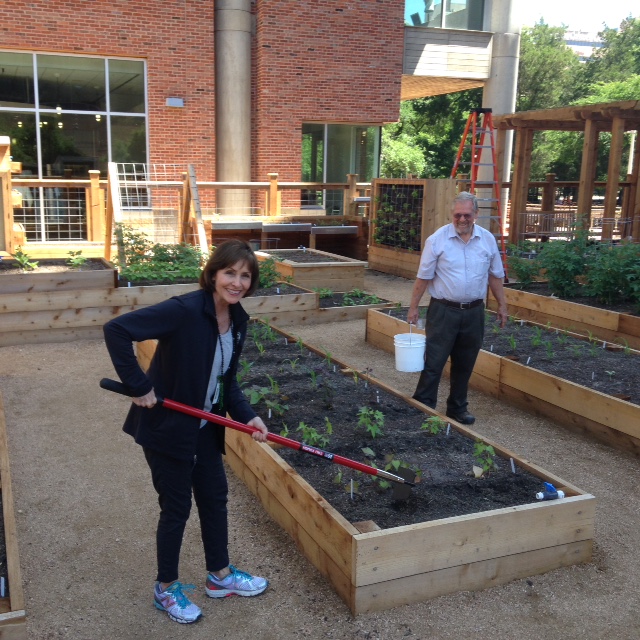 Laura S. Moore in the holistic garden at UTHealth School of Public Health with adjunct professor Joe Novak, who designed the garden. 