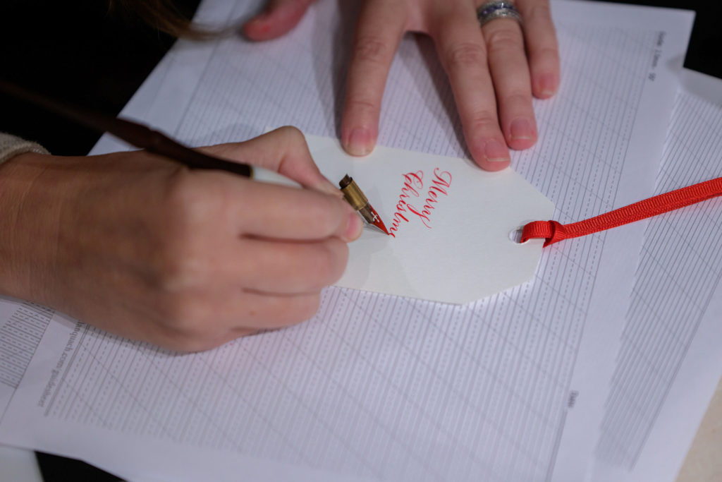The Village provided a team to personalize gift cards for goodies purchased that evening (Photo by WJN Photo)