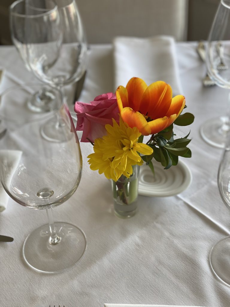 The classical nature of Amore Italian Restaurant is cemented by the white table cloths and fresh flowers.  (Photo by Shelby Hodge)