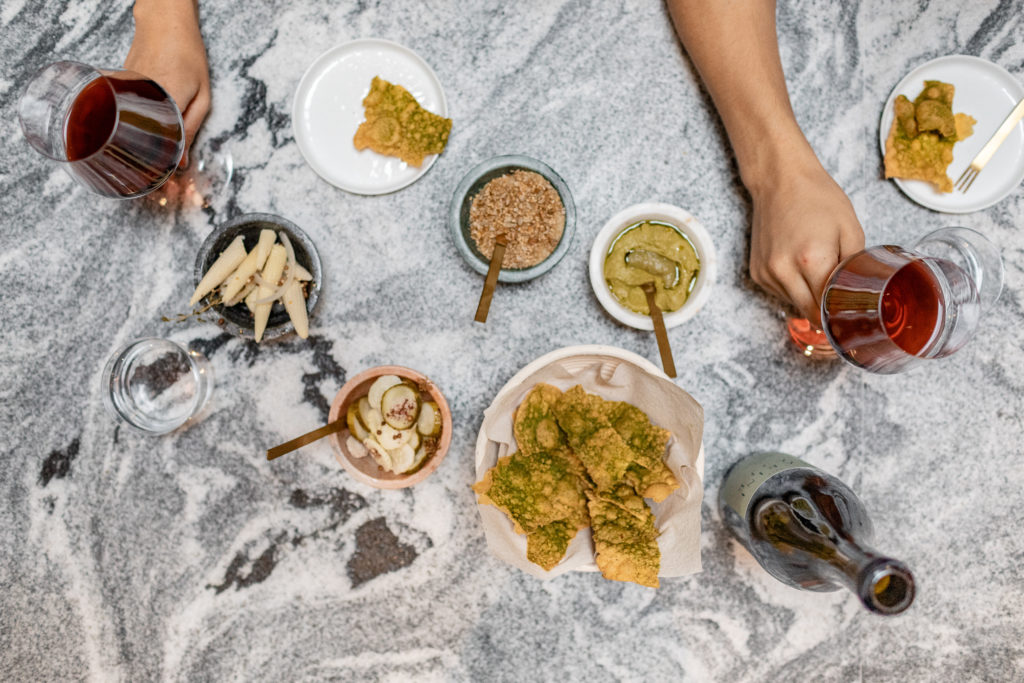 In their new tasting room. Marine Layer serves up wine with coastal influence and delicious vegan treats. 