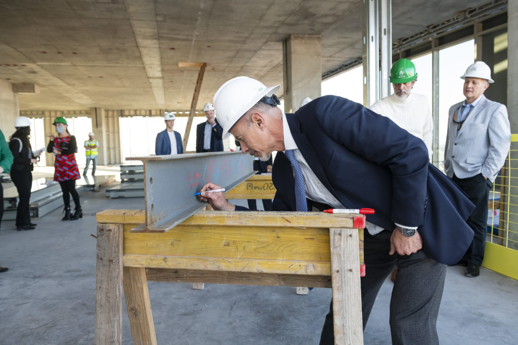 Developer Roberto Contreras of DC Partners signs the beam at the Residences at The Allen. and Thompson Hotel  (Photo by Anthony Rathbun)