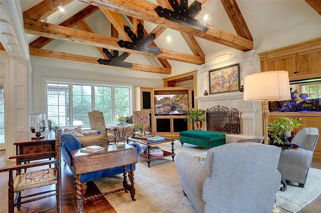 Great room with heavy beams and build in salt water fish tank.