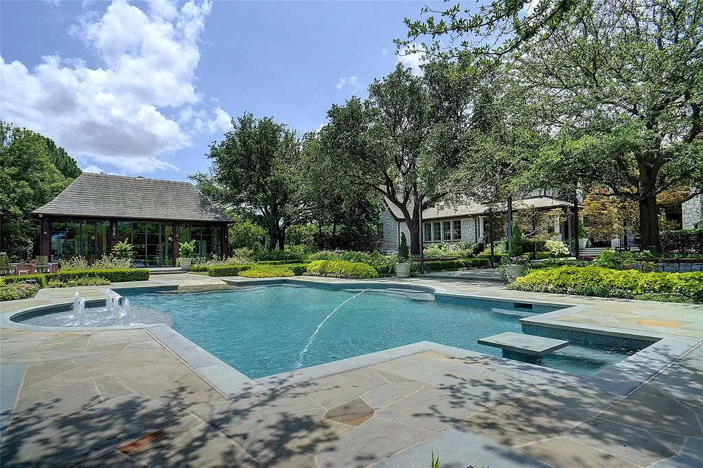 Pool and spa, surrounded by English gardens and guest pool house.
