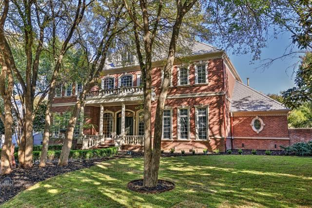 6805 Laurel Valley Drive - symmetry leads the way to the entrance of this Georgian estate.