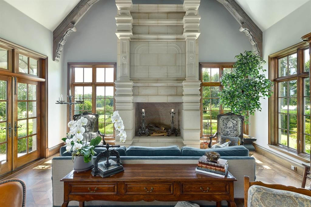 J T Ottinger Road, with arched trusses overhead and heavy stone fireplace.