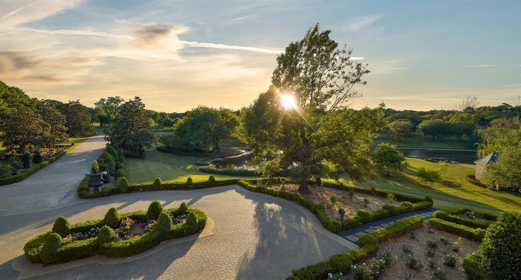 View to the gardens and picturesque pond at it's castle-like setting.