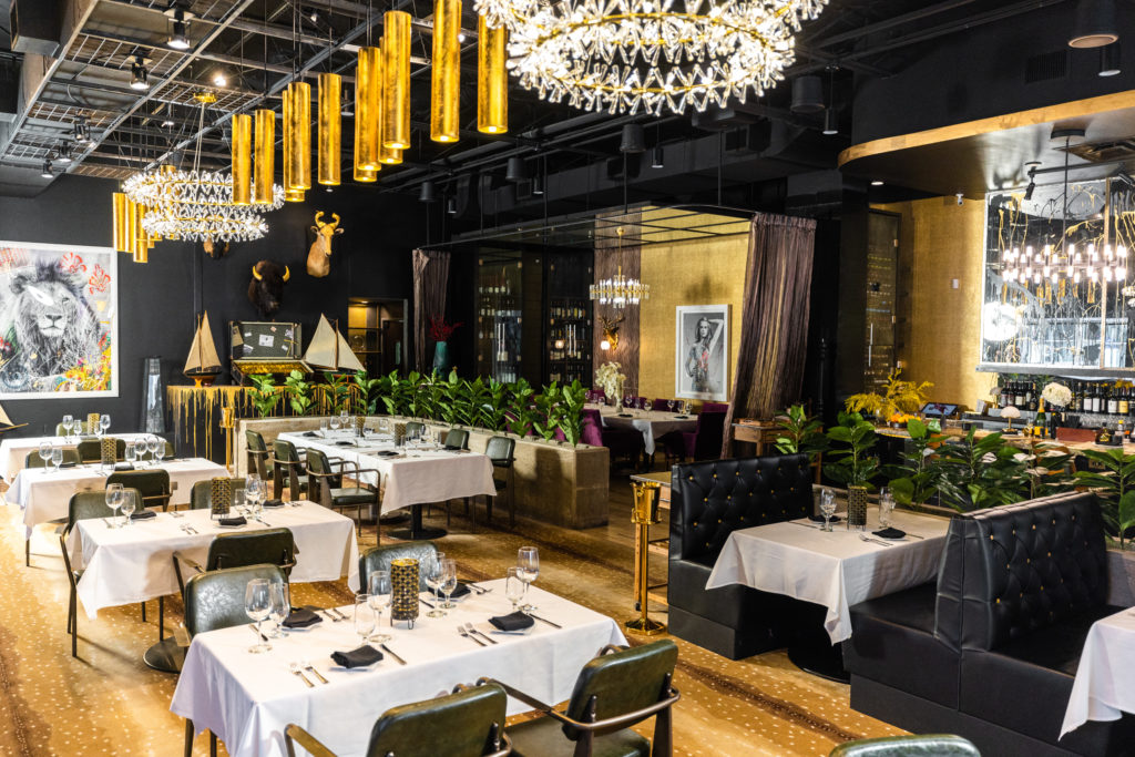 Wits Steakhouse boasts black walls and gold accents everywhere. (Photo by Kathy Tran)