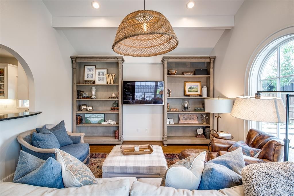 The family room offers patinaed built ins and gorgeous vaulted ceilings. 