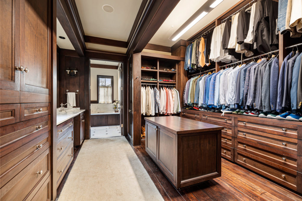 His closet in the owner's suite in the 1722 River Oaks Boulevard home of Frances and Tony Buzbee. (Photo by Courtesy of Josh Gremillion for Douglas Elliman)