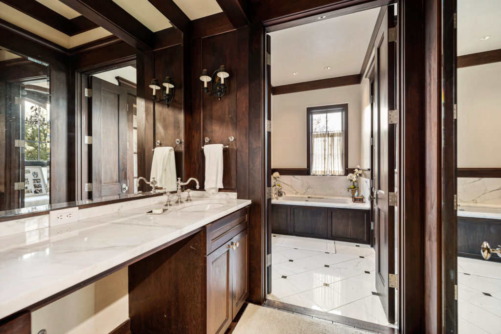 His bath in the owner's suite in the 1722 River Oaks Boulevard home of Frances and Tony Buzbee. (Photo by Courtesy of Josh Gremillion for Douglas Elliman)
