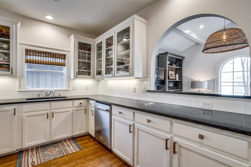 A granite breakfast bar overlooks the welcoming family room. 