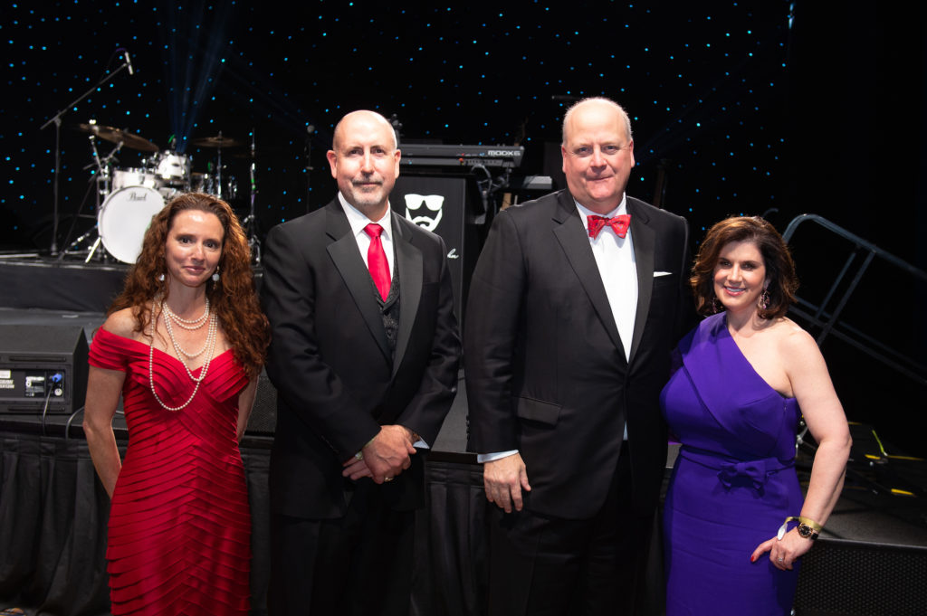 AHA's Amber Baker with Corporate Honorees EY's Dr. Doug Lawson, John King,  and Suzie Kupiec at the American Heart Association Heart Ball. (Photo by Wilson Parish)