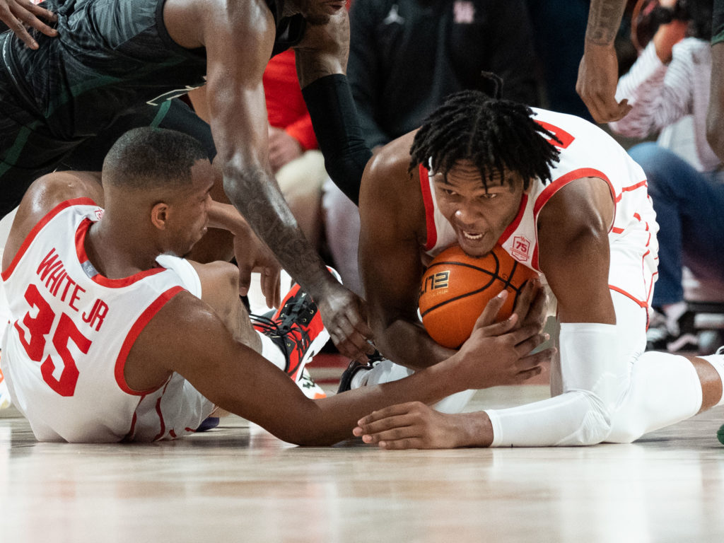 Fabian White Jr., Josh Carlton and the rest of the Coogs are never afraid to hit the floor. (Photo by F. Carter Smith)