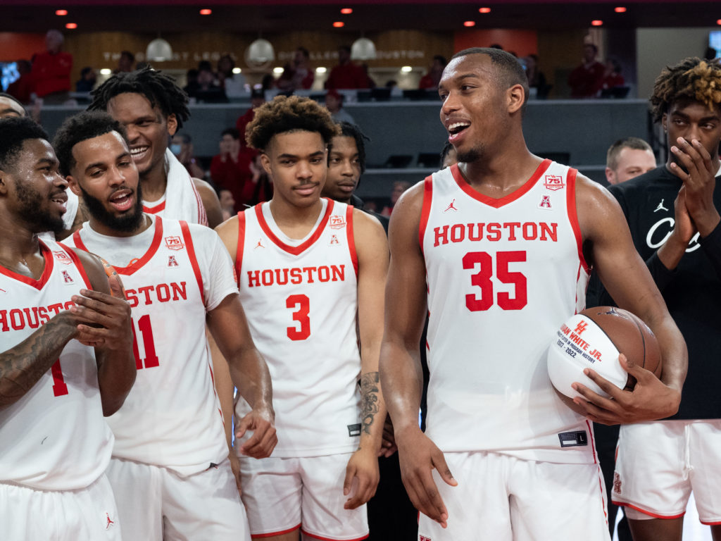 Fabian White Jr.'s University of Houston teammates were pumped to see him break the school's all-time wins record. (Photo by F. Carter Smith)