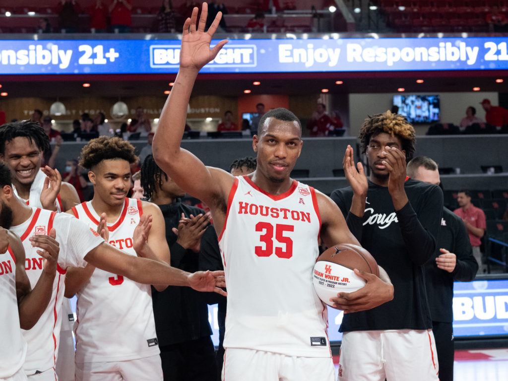 Becoming the winningest player in the impressive history of UH's basketball program calls for a little ceremony. (Photo by F. Carter Smith)