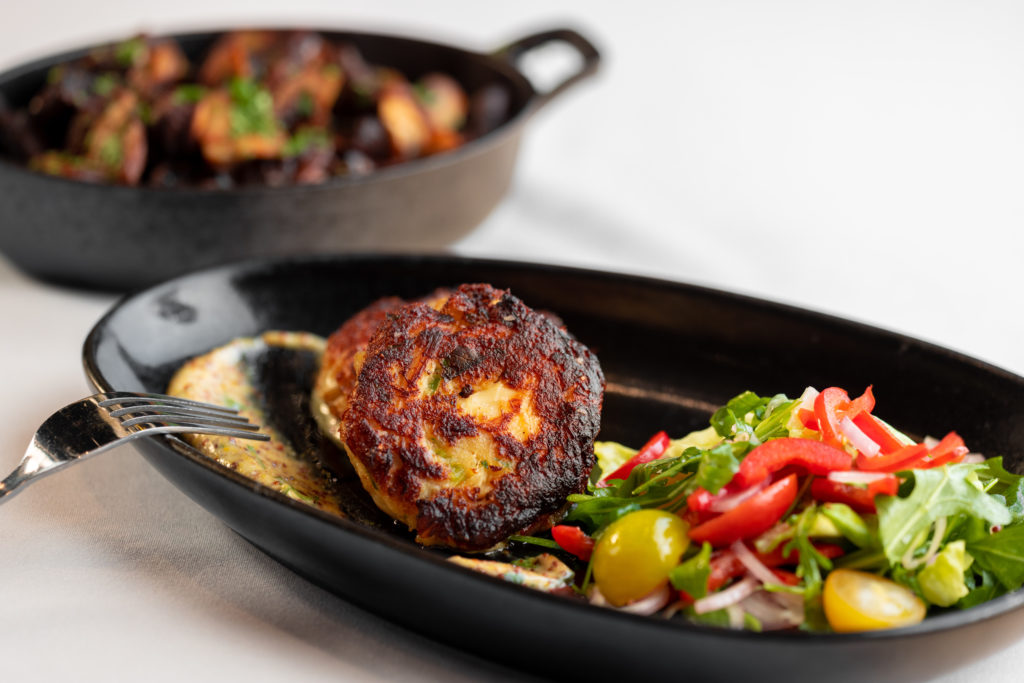 The Jumbo Crab Cakes are a must-try at Wits Steakhouse. (Photo by Kathy Tran)