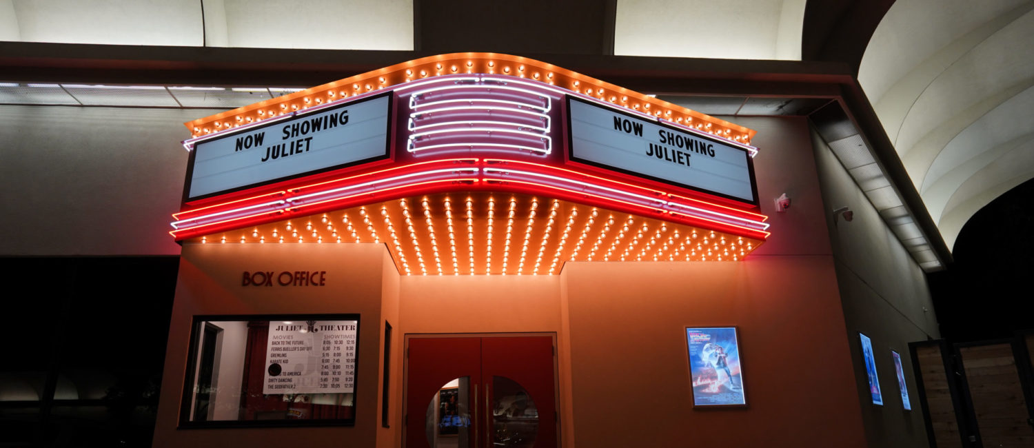 The faux movie theater entrance, including the box office, to Juliet belies the chic restaurant inside. (Photo by In-House Social)