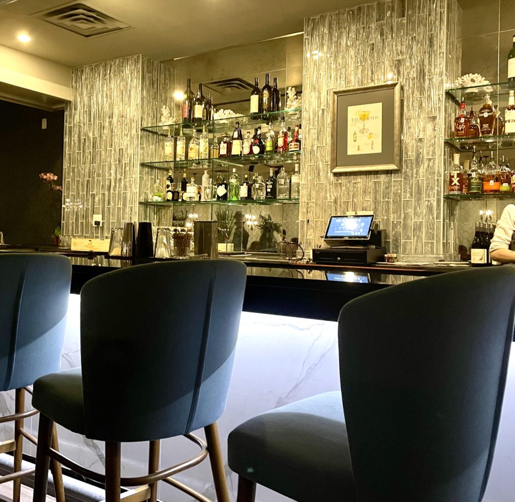 The classy front room bar is joined by a back room bar and new patio. Photo by Courtney Dabney.