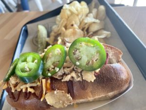 Lockwood – The Big Tex Dog topped with fried onions, BBQ sauce and jalapeno slices. Photo by Courtney Dabney.