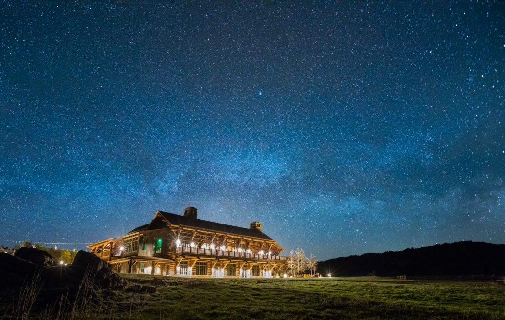 Lodge at Night_credit Brush Creek Ranch Luxury Ranch Collection