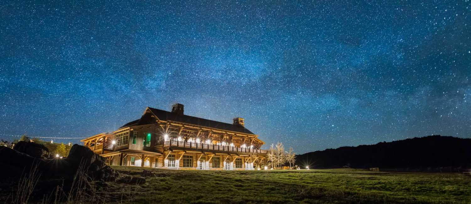 Lodge at Night_credit Brush Creek Ranch Luxury Ranch Collection