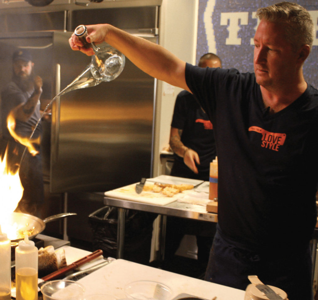 Tim Love doing a cooking demonstration, plans a full music venue for his encore.