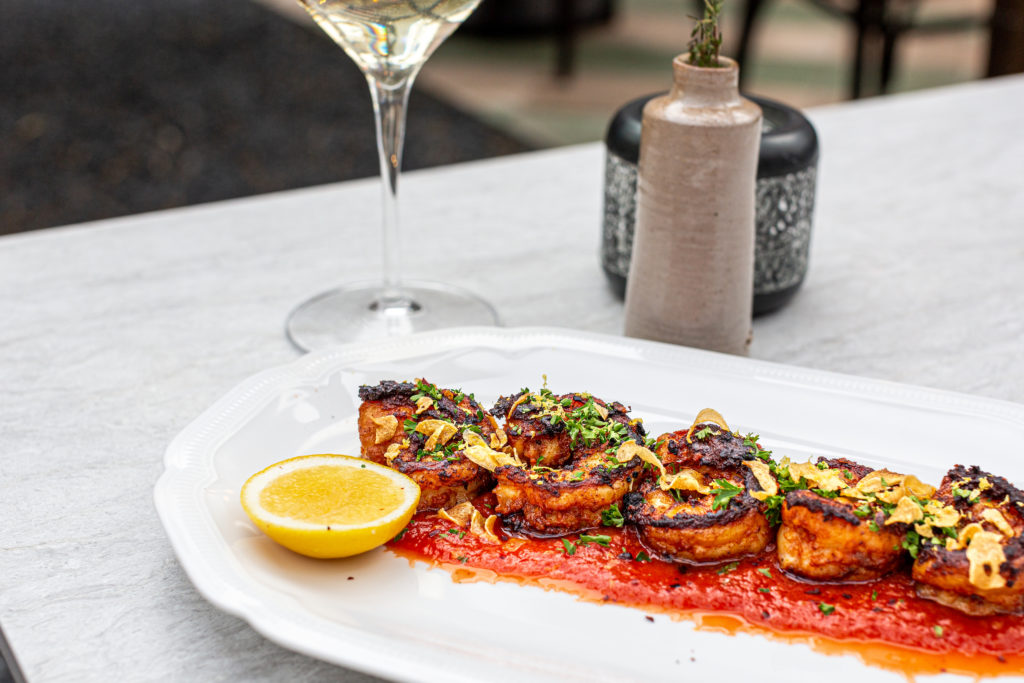 Gamberi Fra Diavolo, a spicy pan-fried shrimp cooked in a smokey and spicy tomato sauce with parsley, garlic, pepperoncini, and lemon. Photo by Jenn Duncan.