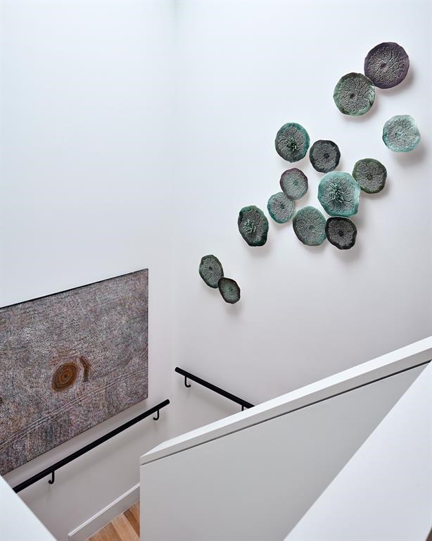 Pristine white oak floors guide you upstairs. 