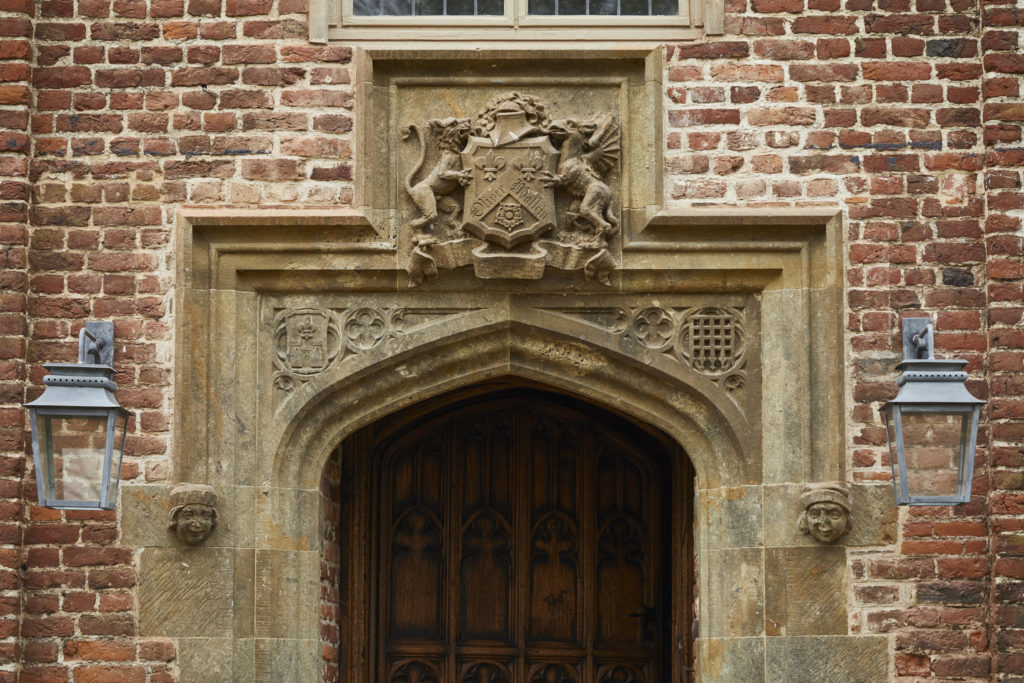 Zeus hanging lanterns on brackets at The Pig at Bridge Place