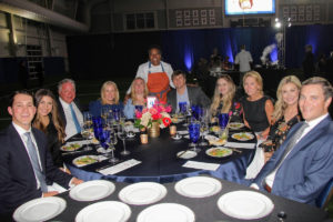 Chef Miriam Jimenez serving sponsors C2 Advisors, Boynton, Brown, Gunawan & Nettle