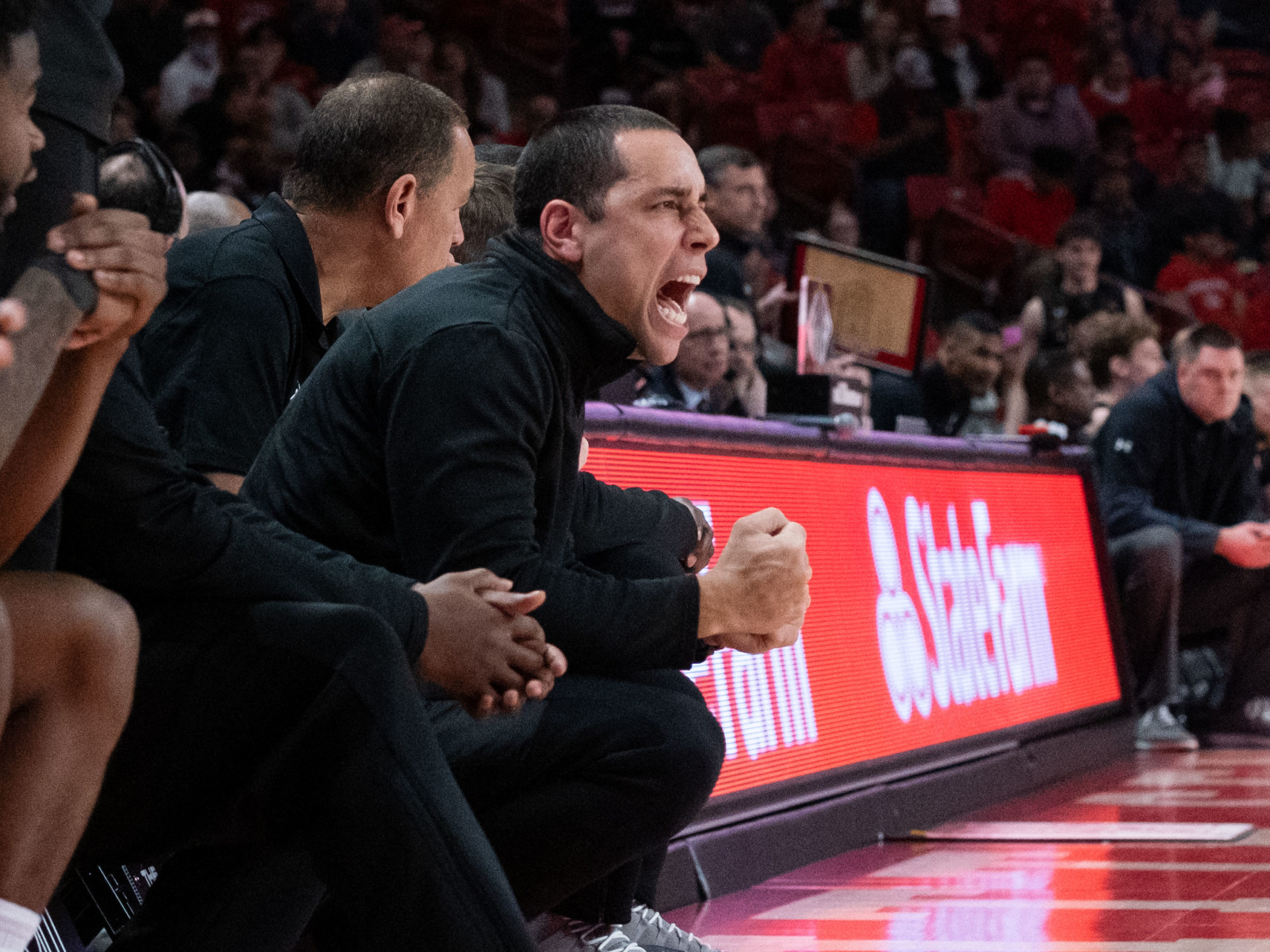 University of Houston assistant coach Kellen Sampson always brings a lot of intensity. (Photo by F. Carter Smith)