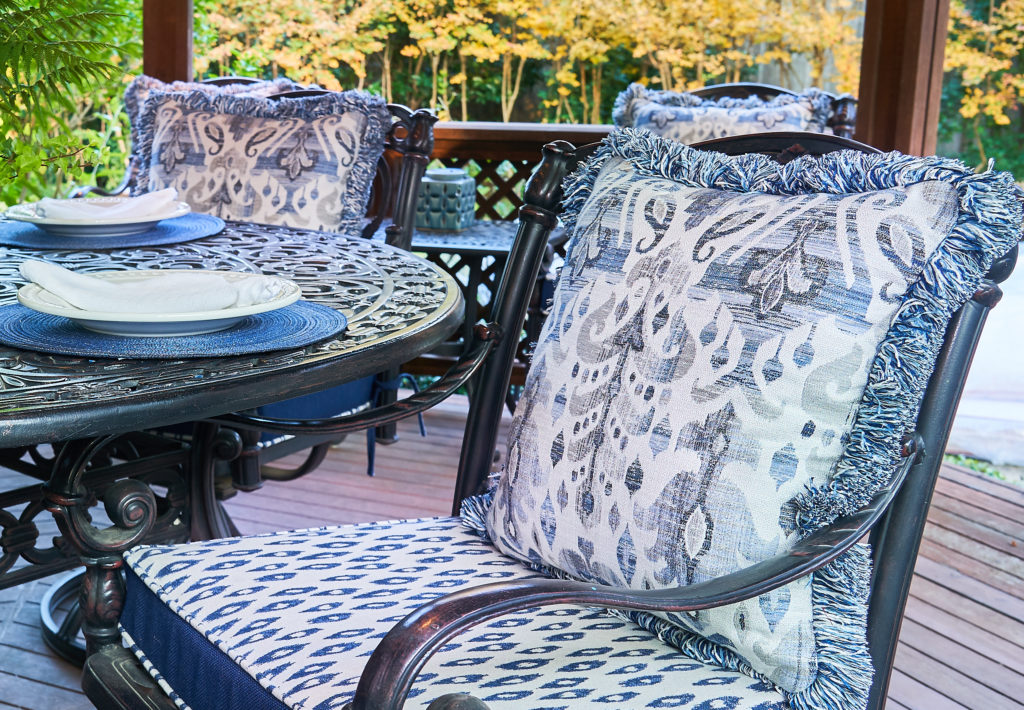 According to Cush Living, the easiest and most affordable way to refresh any outdoor living space is to update the cushions and pillows.