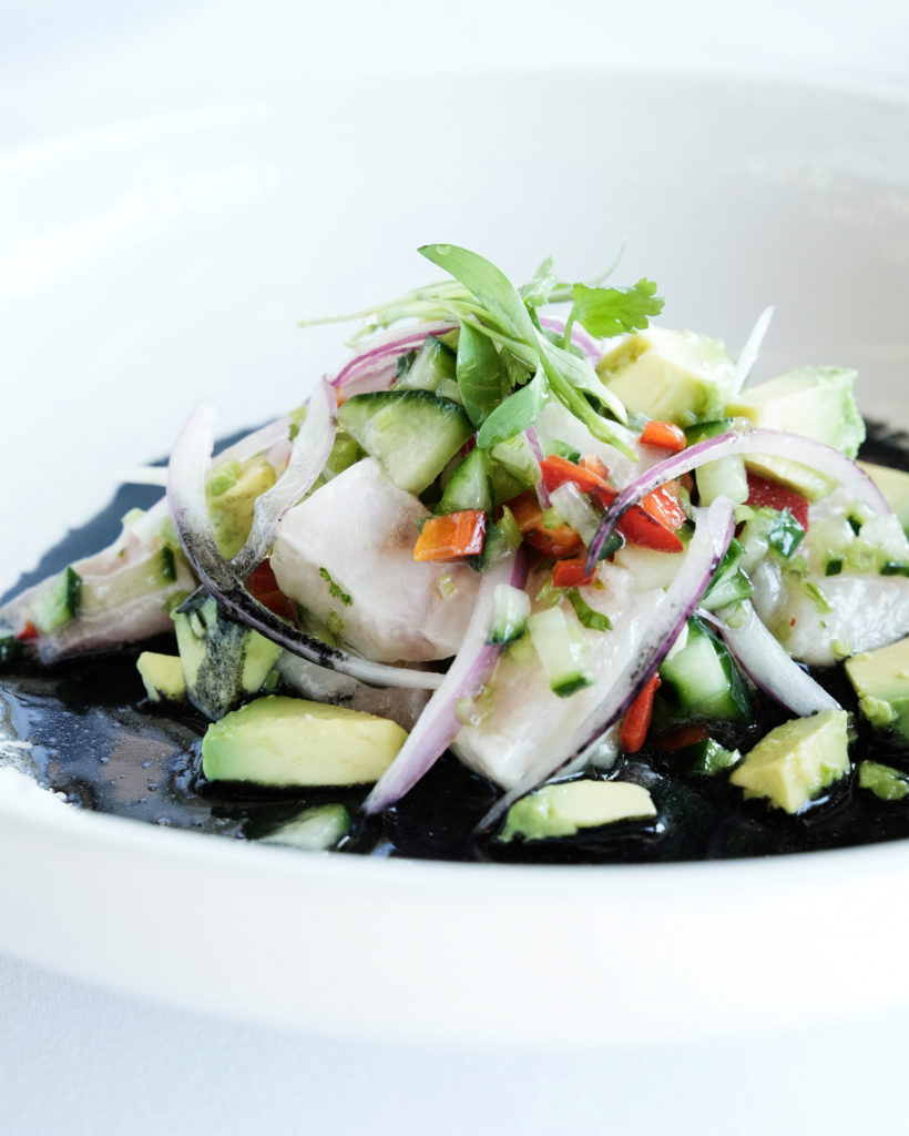 The dramatic looking Ceviche Negro - created with yellowtail tuna is served over squid ink blended with corn, pepper ash, and lime and when combined tints the dish black. (Photo by Jack Thompson)